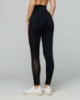 Leggings fitness con inserti in tulle laterali • Nero