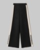 Pantalone In Maglia A Palazzo Con Bande In Contrasto E Logo In Punto Rovescio • Nero