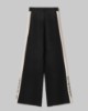Pantalone In Maglia A Palazzo Con Bande In Contrasto E Logo In Punto Rovescio • Nero