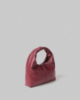 Picture of Small Faux Leather Bag with Metal Tag and Plate • Bordeaux