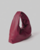 Picture of Medium Faux Leather Bag with Metal Label and Plate • Bordeaux