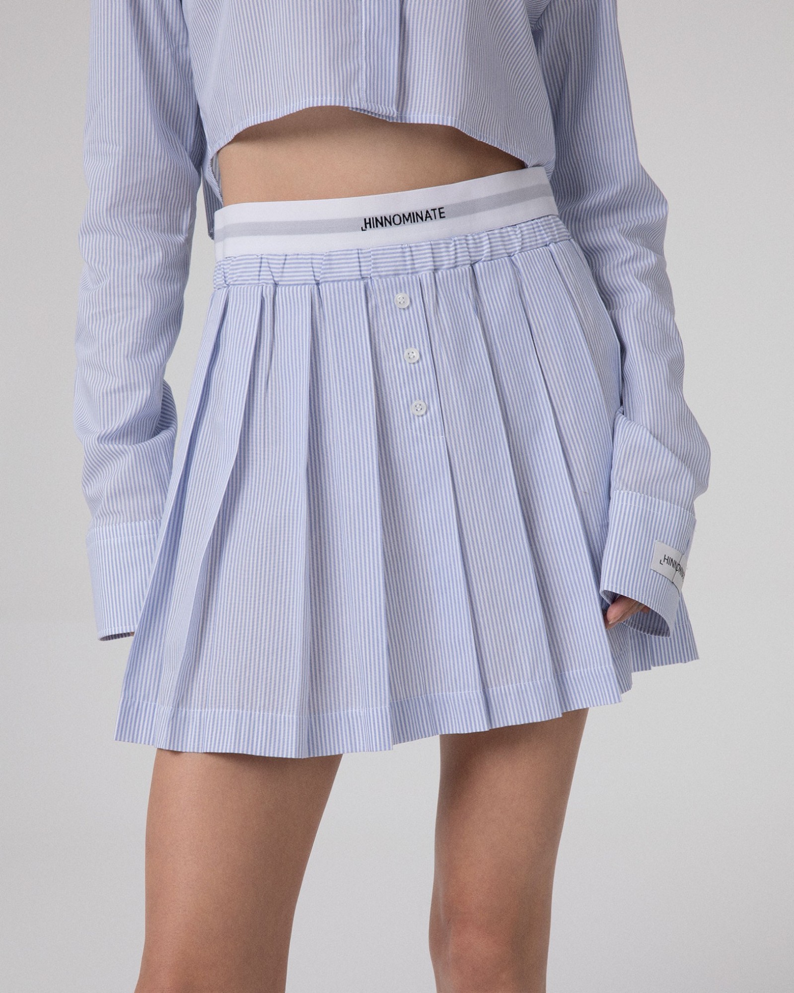 Gonna Corta A Pieghe Rigata In Cotone Con Elastico In Vita Logato • Azzurro
